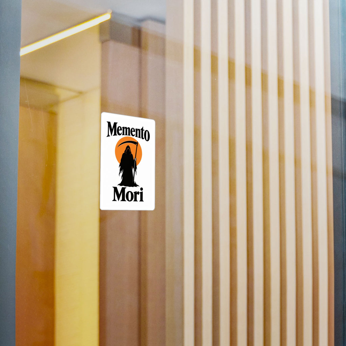 Memento Mori grim reaper vinyl sticker applied to a glass door