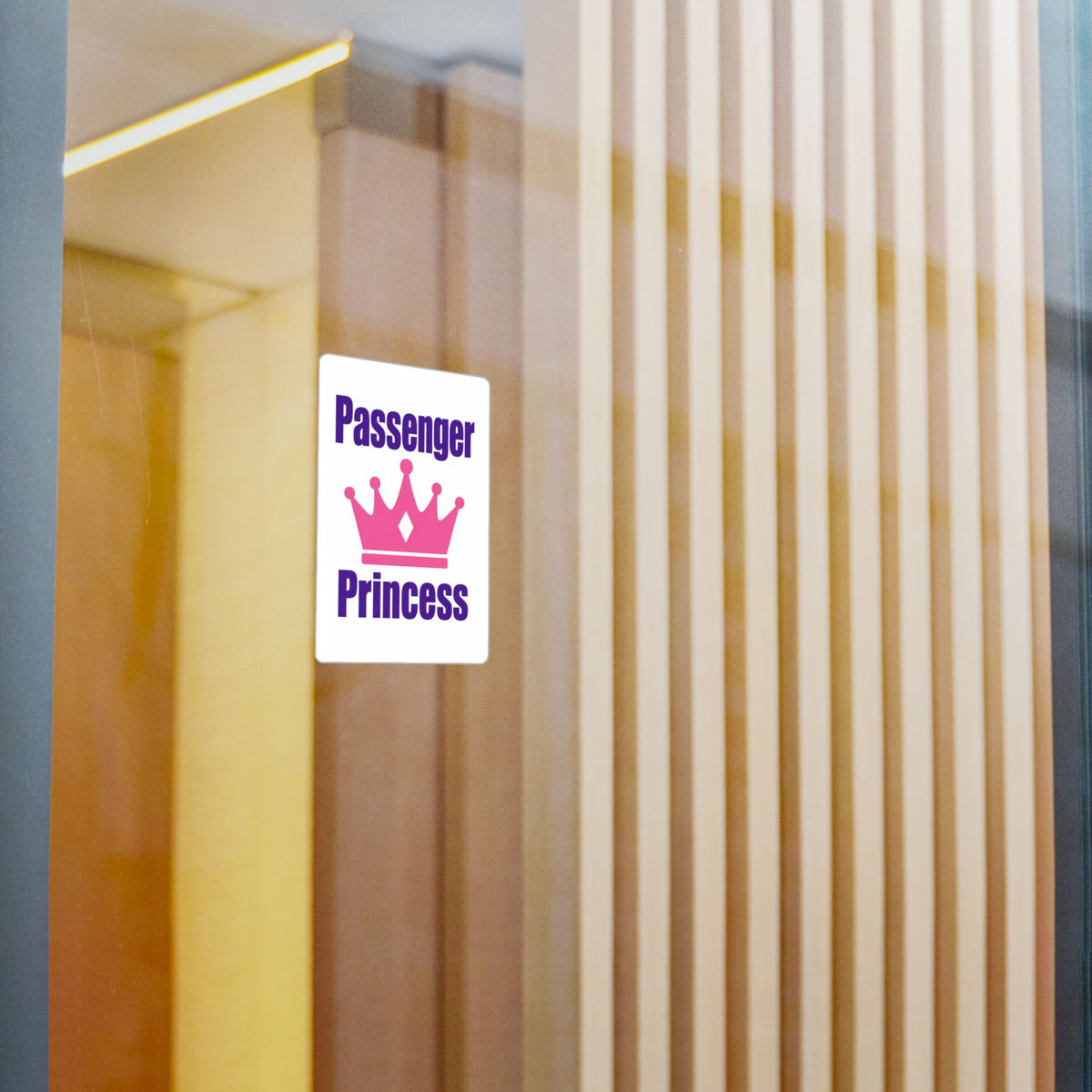 Passenger Princess vinyl sticker applied to a glass door