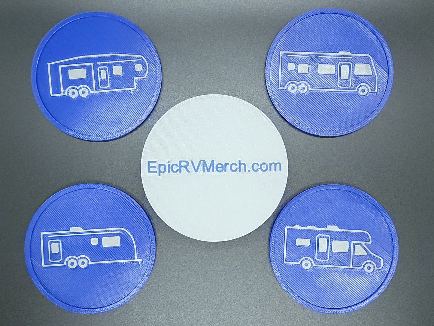 Four blue coasters with RV design on a gray background, featuring EpicRVMerch.com.