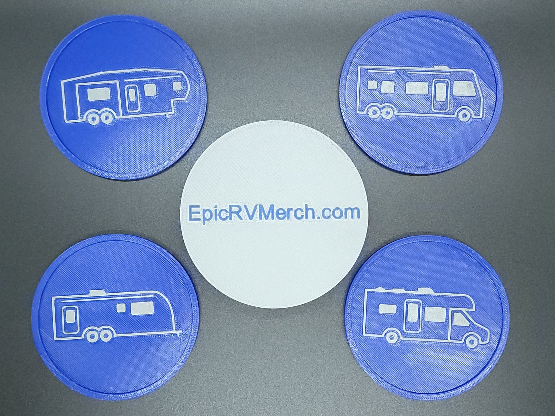 Four blue coasters with RV design on a gray background, featuring EpicRVMerch.com.