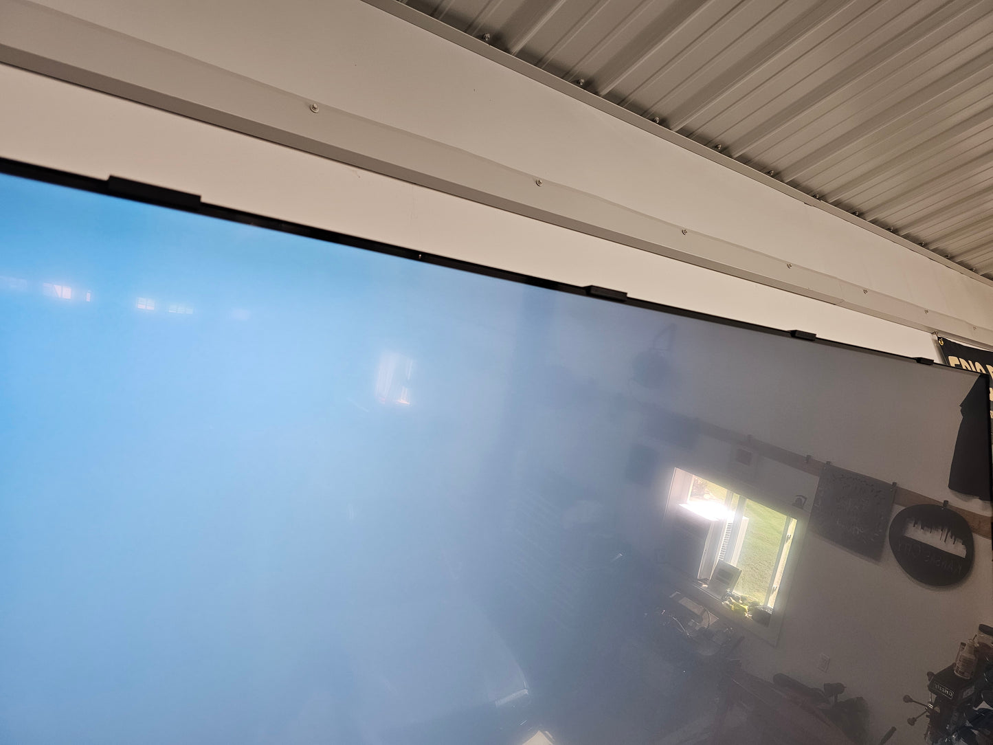Close up of a Samsung TV screen with screen retention repair clips installed