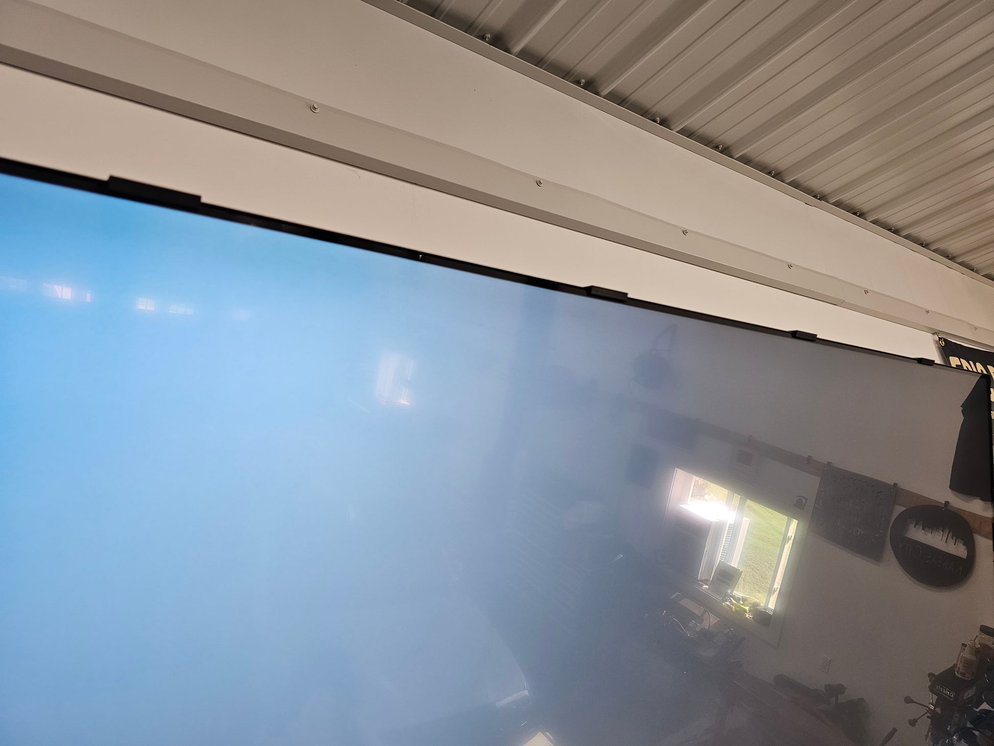 Close up of a Samsung TV screen with screen retention repair clips installed