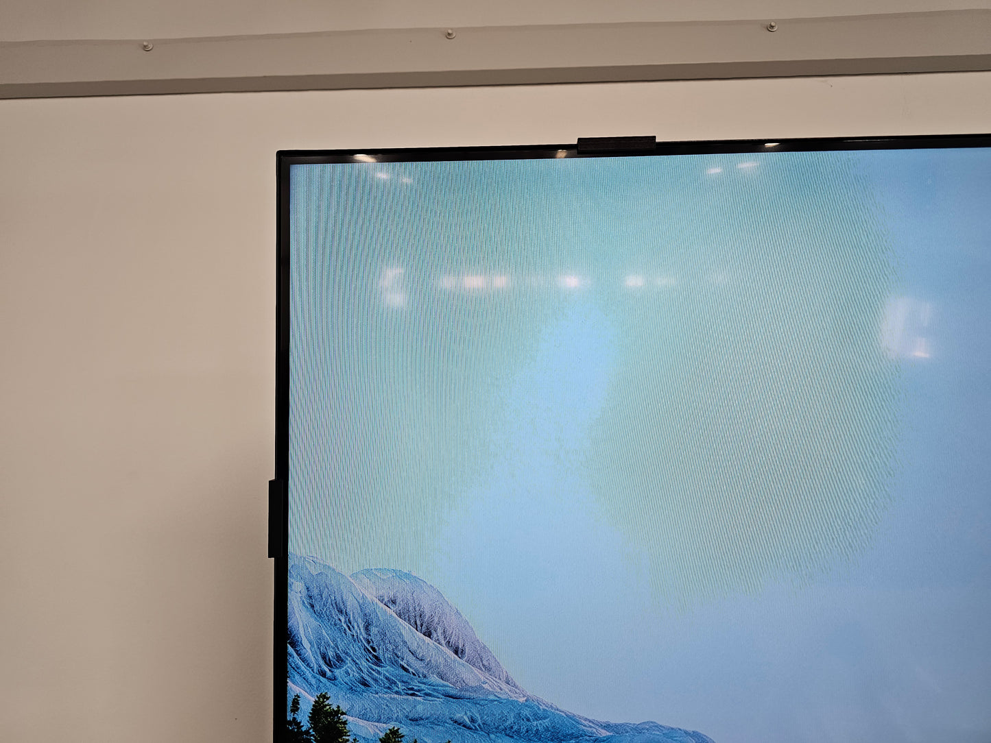 Samsung TV with screen retention repair clips installed close up