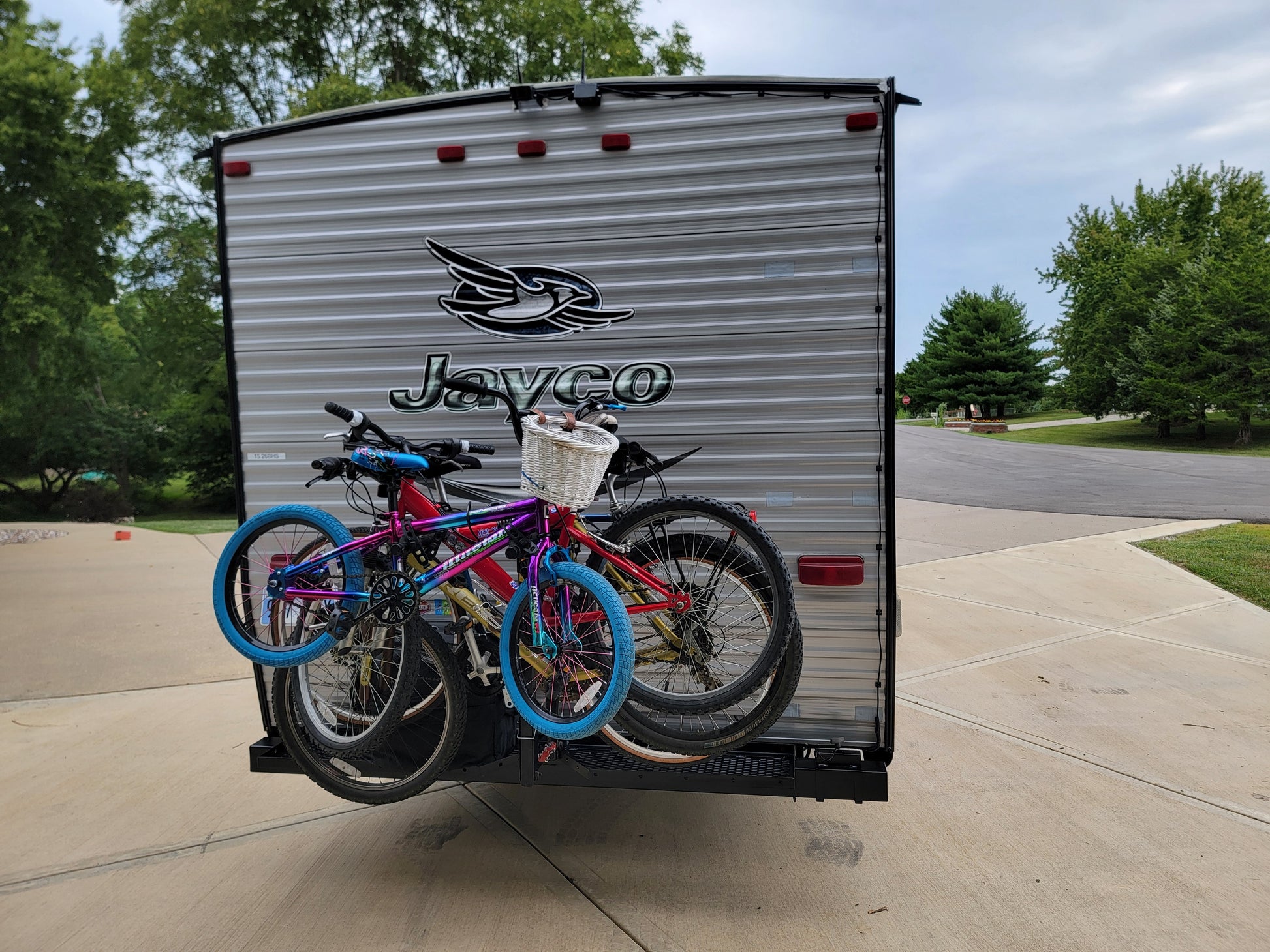 Jayco RV with bicycles attached on a driveway
