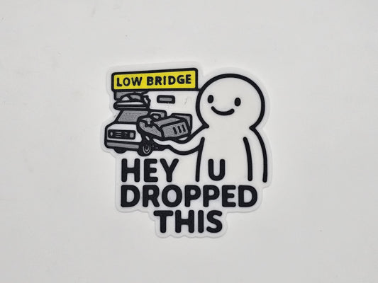 White and black Hey You Dropped This low bridge RV magnet with flattened camper