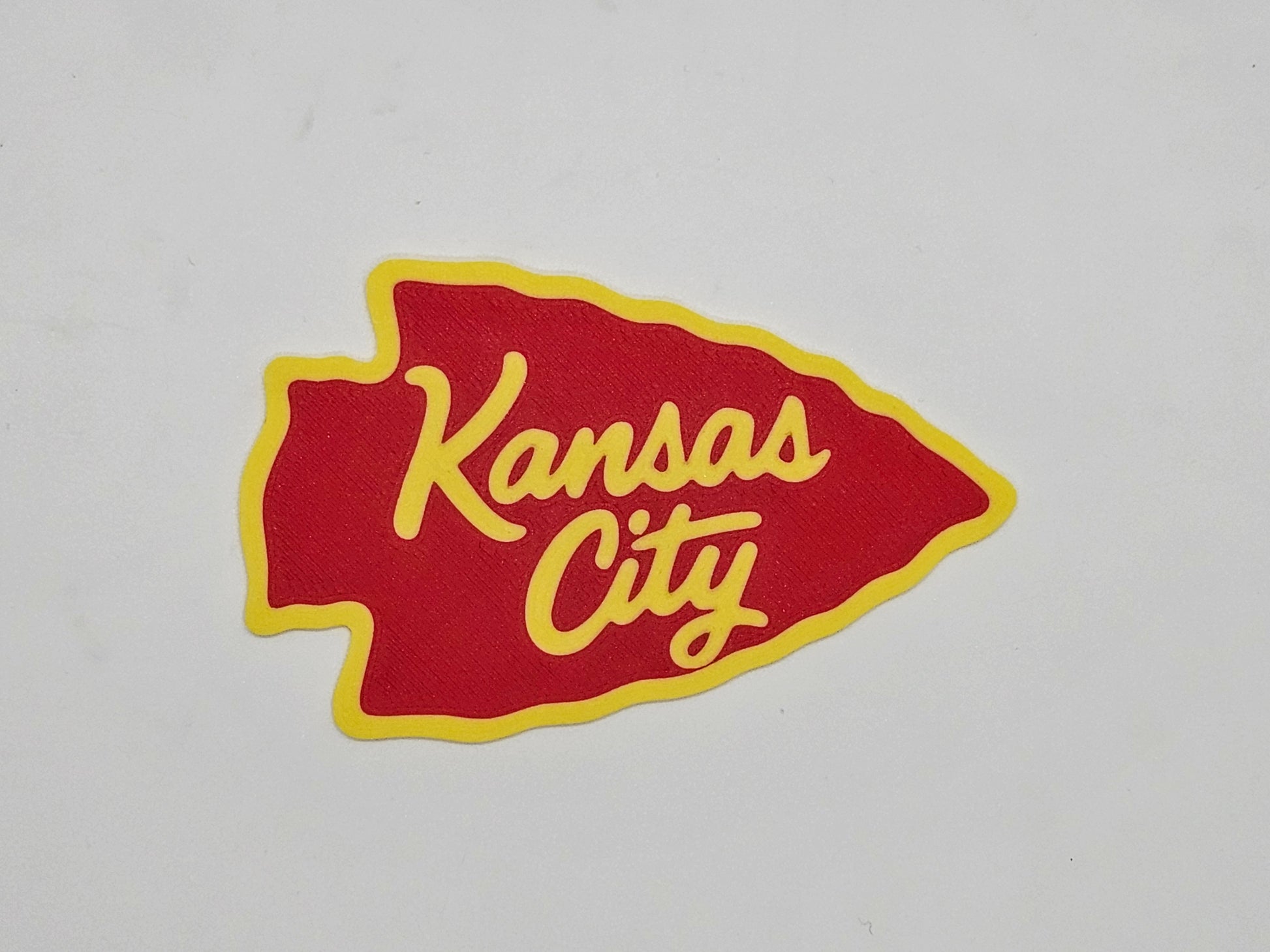 Red and yellow Kansas City arrowhead magnet