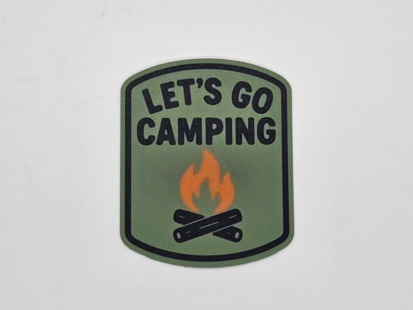 Olive, black, and orange Let's Go Camping campfire RV magnet