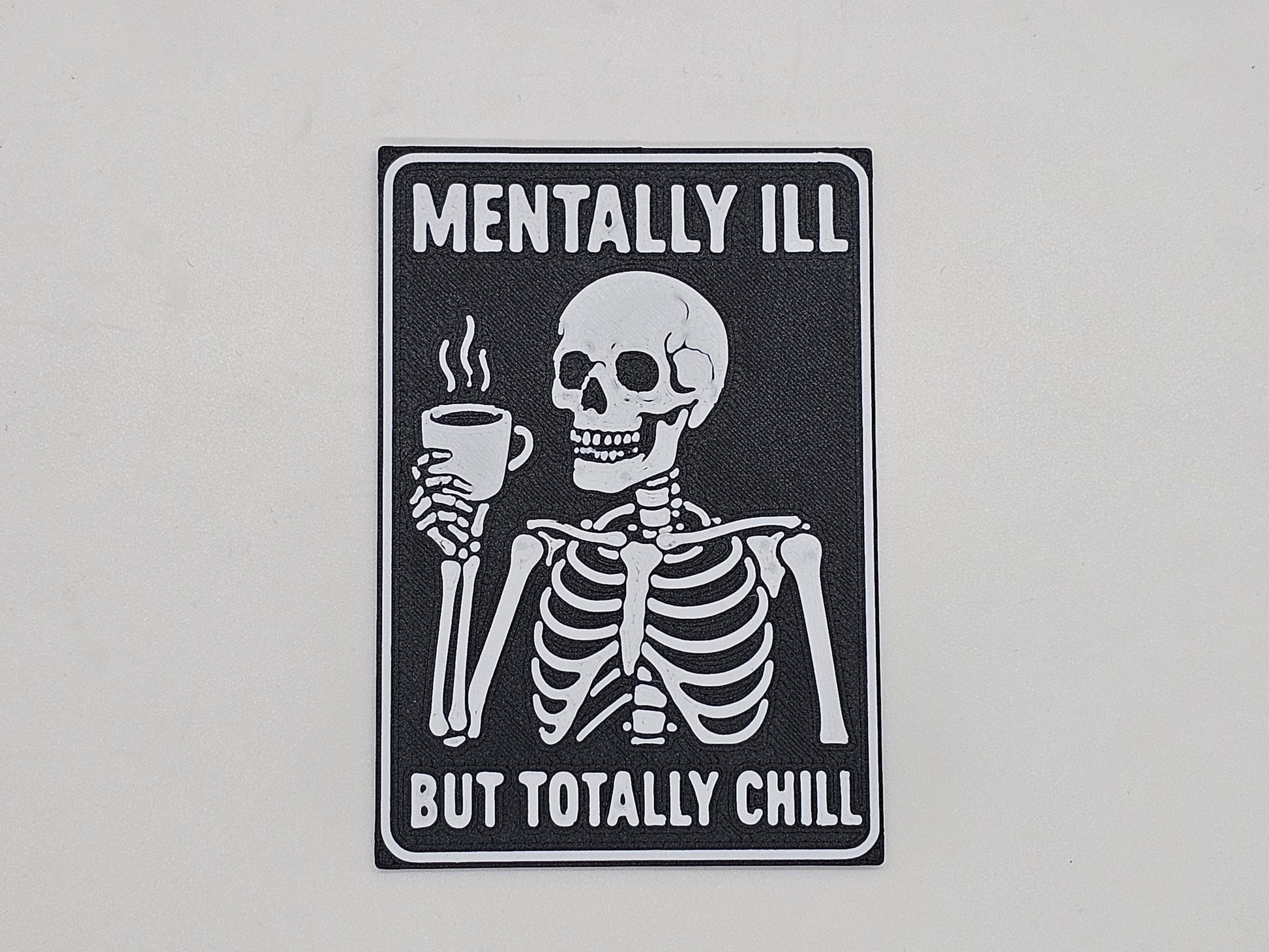 Black and white Mentally Ill but Totally Chill skeleton coffee magnet