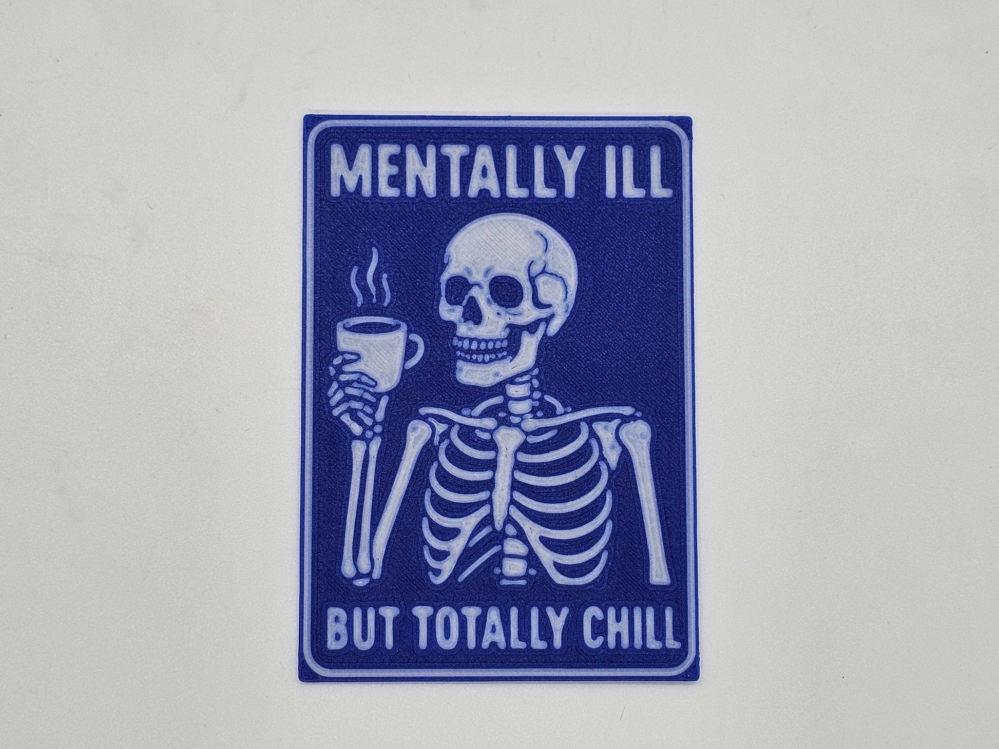Blue and white Mentally Ill but Totally Chill skeleton coffee magnet