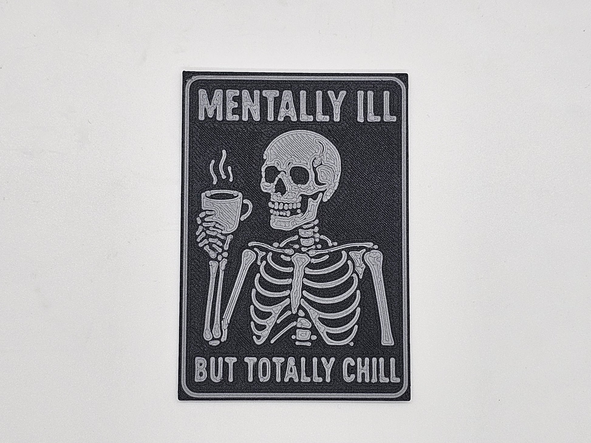Charcoal and gray Mentally Ill but Totally Chill skeleton coffee magnet