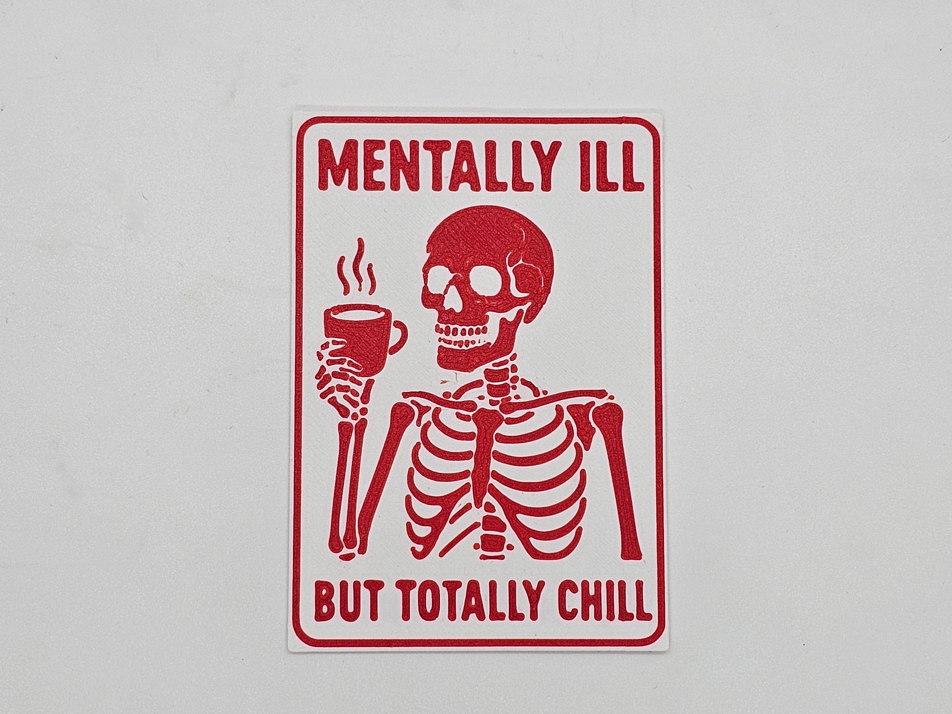 White and red Mentally Ill but Totally Chill skeleton coffee magnet