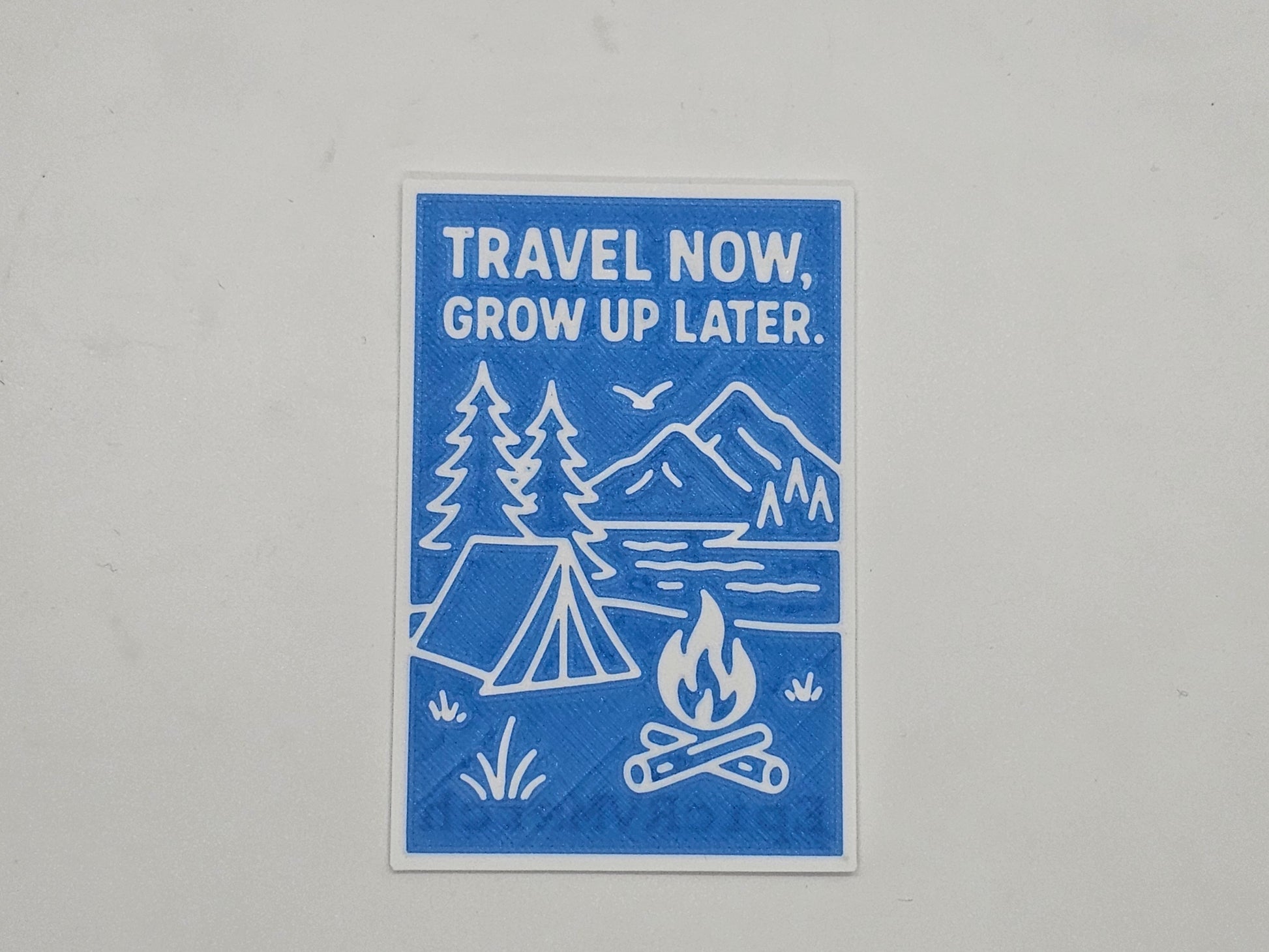 Blue and white Travel Now Grow Up Later camping magnet