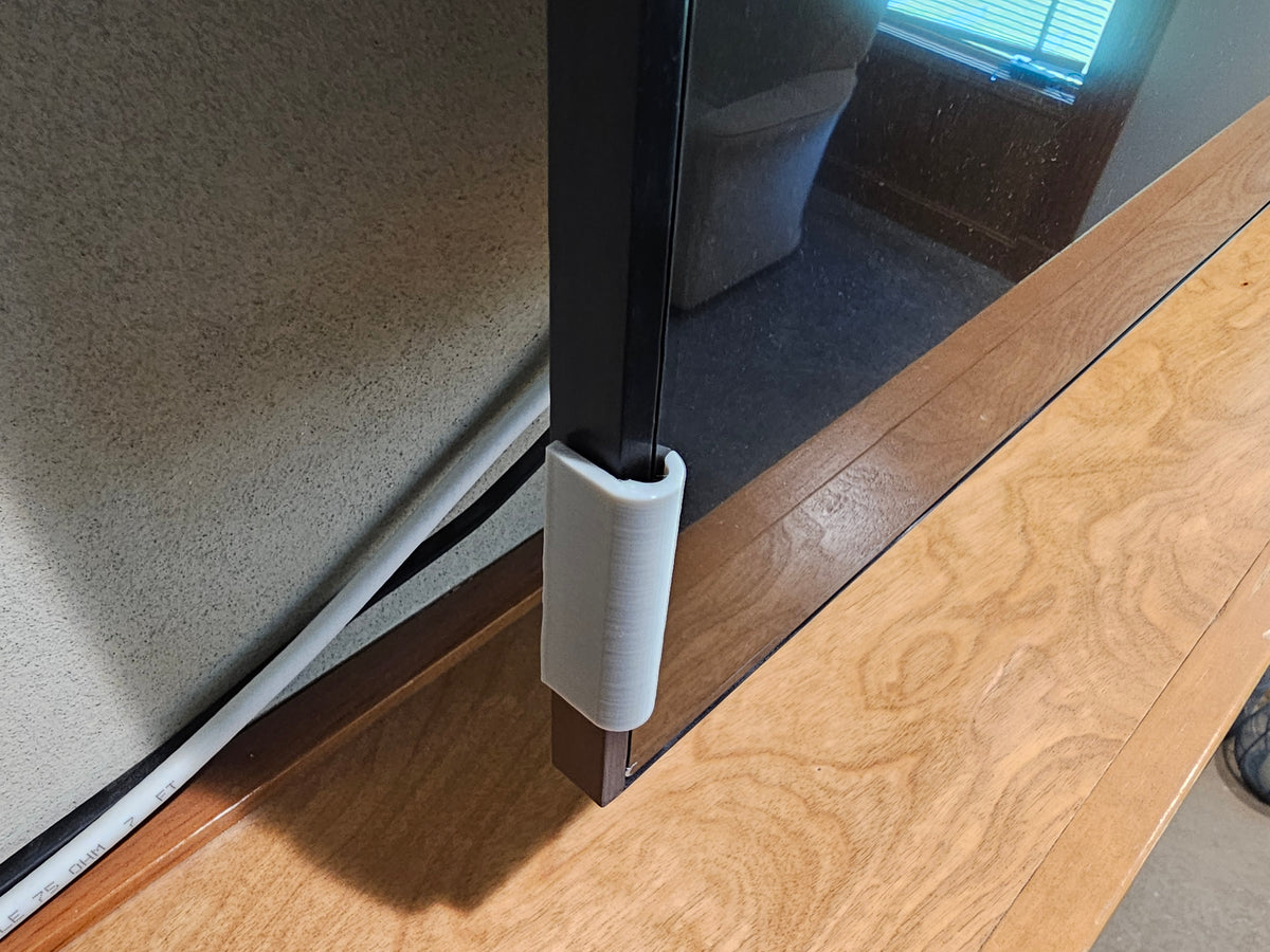 Silver TV screen retention clip showing the lip that holds the screen panel in place